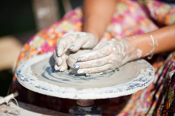 stock image Hand on a potter wheel at the fair