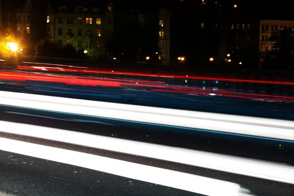 Strip of passing cars on the street overnight — Stock Photo, Image