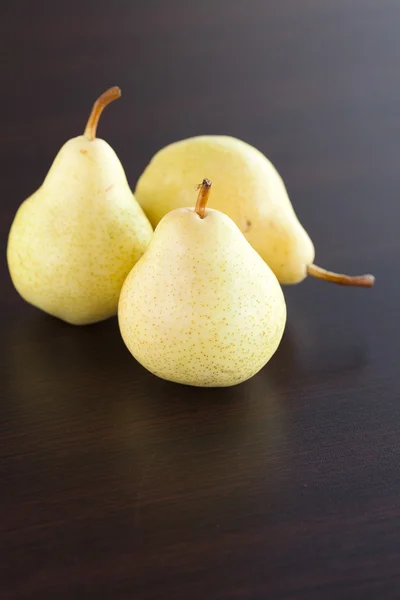 stock image Pear lying on a wooden table