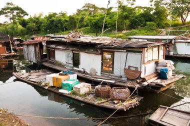 Rural slum on rier, favela in China clipart