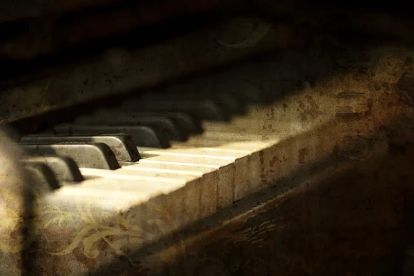 stock image Piano side view with keys lost in the light.