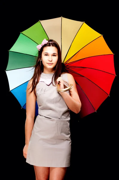 Renkli şemsiye ile genç kadının portresi — Stok fotoğraf