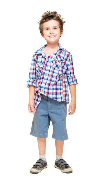 Zlobivý vlasatý chlapeček v krátkých kalhotách a košili — Stock fotografie