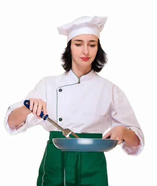 Mooie vrouw in chef-kok uniform met pan en vork — Stockfoto