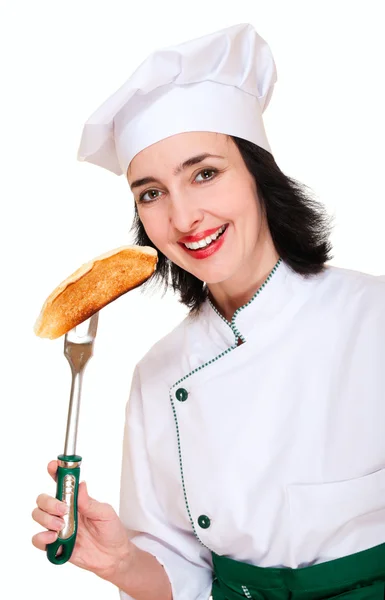 Mulher bonita em uniforme de chef com brinde — Fotografia de Stock