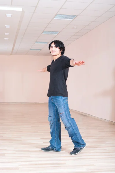 stock image Young cheerful dancer man in training hall