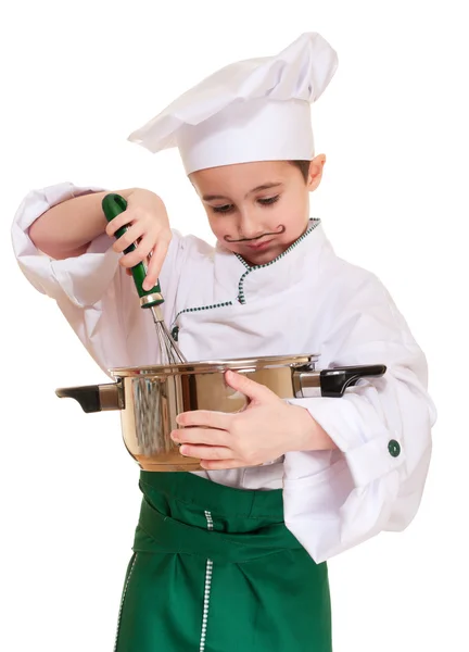 Malý kuchař s kuchyňské nádobí vaření — Stock fotografie