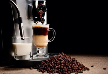 Coffee machine and beans heap clipart