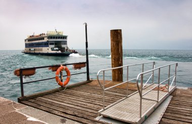 Ferryboat leaving the harbor clipart