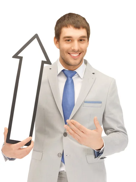 Businessman with direction arrow sign — Stock Photo, Image