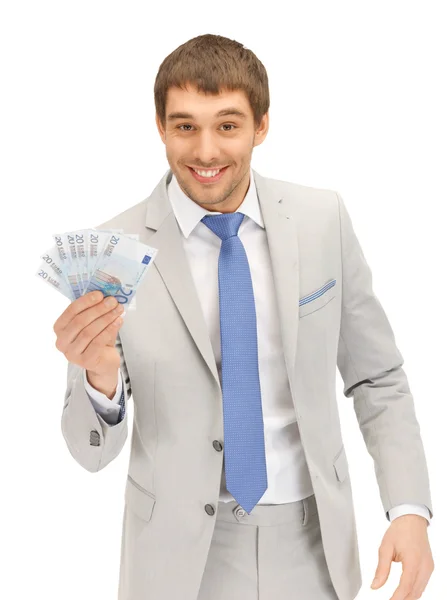 Hombre guapo con dinero en efectivo en euros — Foto de Stock