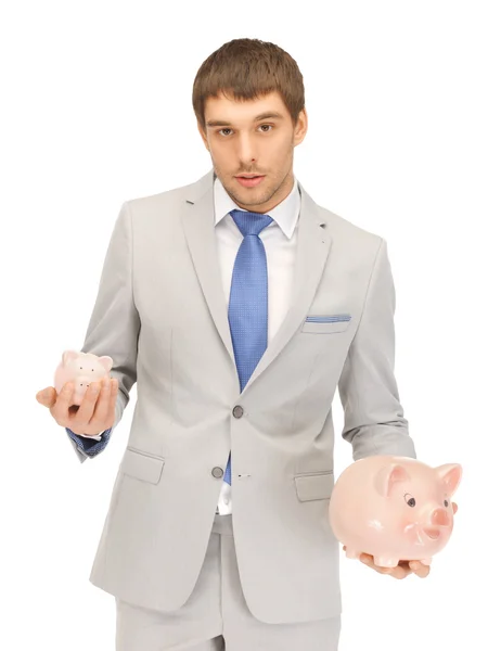 Человек со свиным банком — стоковое фото