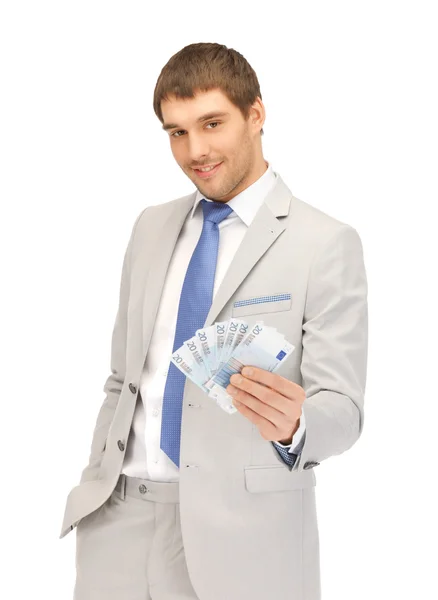 Pohledný muž s euro hotovost — Stock fotografie