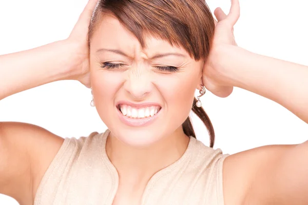 Mulher infeliz com as mãos nas orelhas — Fotografia de Stock