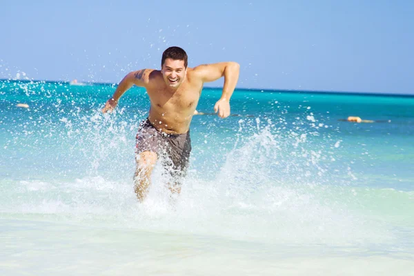 Running out of the ocean — Stock Photo, Image