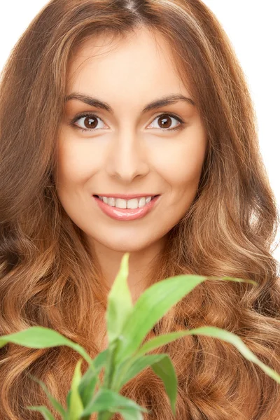 Woman with green sprout — Stock Photo, Image