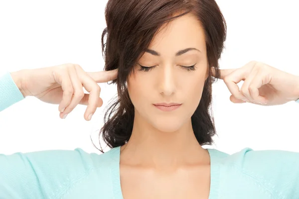 Vrouw met vingers in de oren — Stockfoto