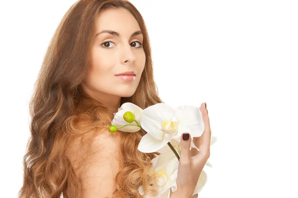 Vacker kvinna med orkidé blomma — Stockfoto