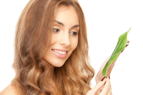 Woman with green leaf — Stock Photo, Image