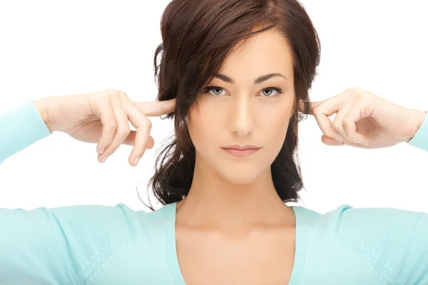 Mujer con dedos en las orejas Imagen De Stock