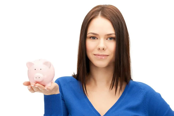 Mulher encantadora com banco porquinho — Fotografia de Stock