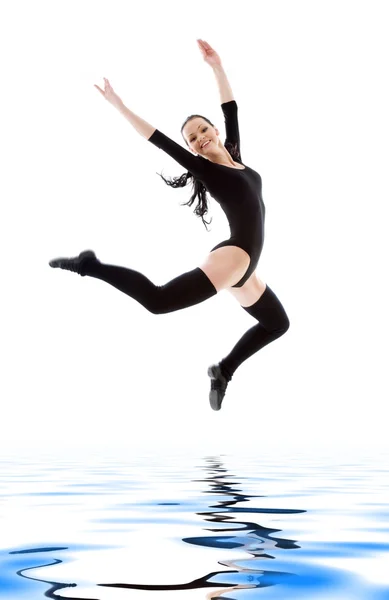 Jumping girl in black leotard — Stock Photo, Image