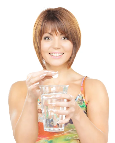 Mujer con píldora y vaso de agua —  Fotos de Stock