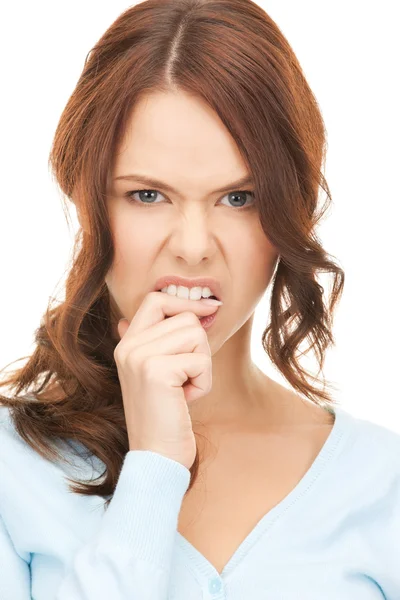 Woman biting her finger — Stock Photo, Image