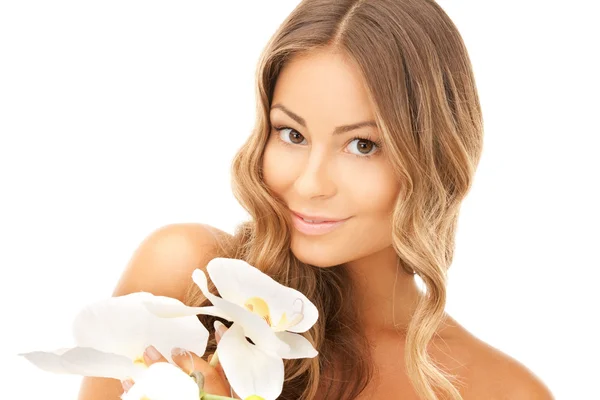 Beautiful woman with orchid flower Royalty Free Stock Images
