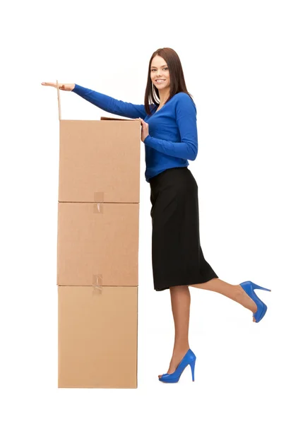Attractive businesswoman with big boxes — Stock Photo, Image