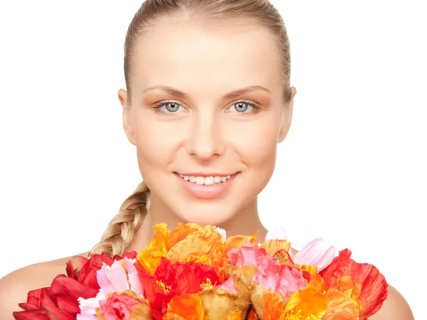 Lovely woman with red flowers — Stock Photo, Image