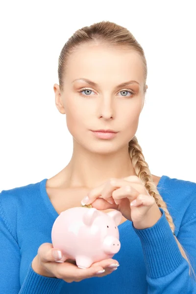 可爱的女人与猪存钱罐和钱 — 图库照片