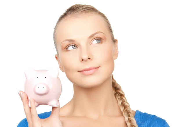 Schöne Frau mit Sparschwein — Stockfoto