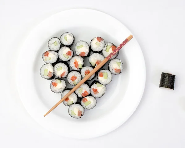 Sushi on a plate in the shape of heart — Stock Photo, Image