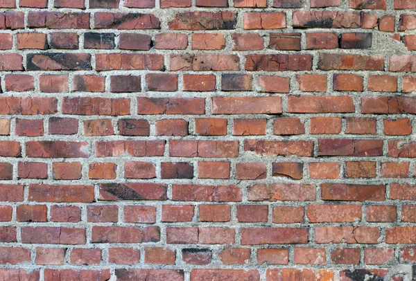 Vieja pared de ladrillo rojo teñido resistido — Foto de Stock