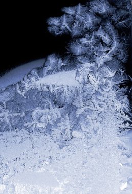 Frost patterns on window glass clipart