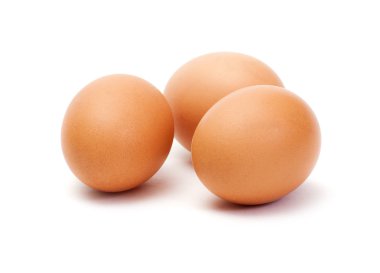 Three brown eggs on white background clipart