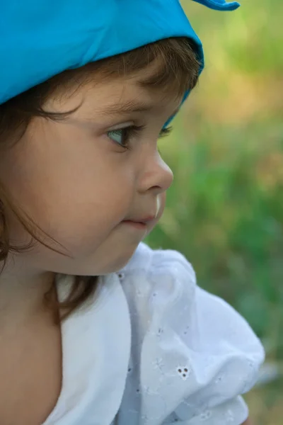 Portrait of a little girl in blue hat — Stock Photo, Image