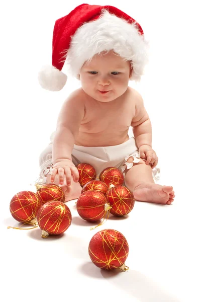Bebê em Santa chapéu jogando — Fotografia de Stock