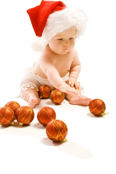 Младенец с рождественским украшением — стоковое фото