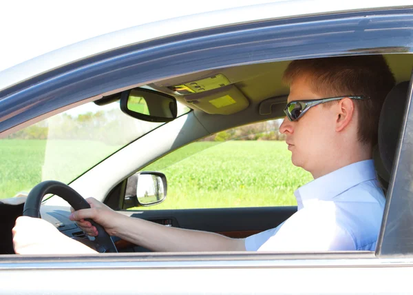 Man driving a car Stock Image