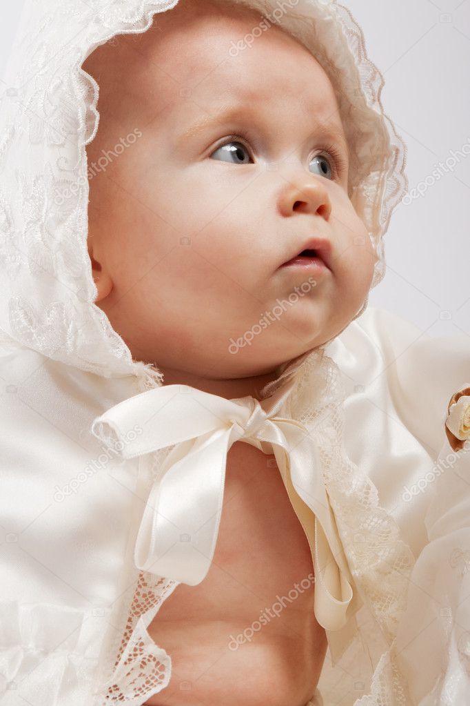 Baby in baptismal clothes