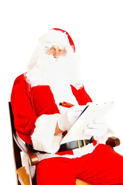 Weihnachtsmann mit Wunschliste — Stockfoto