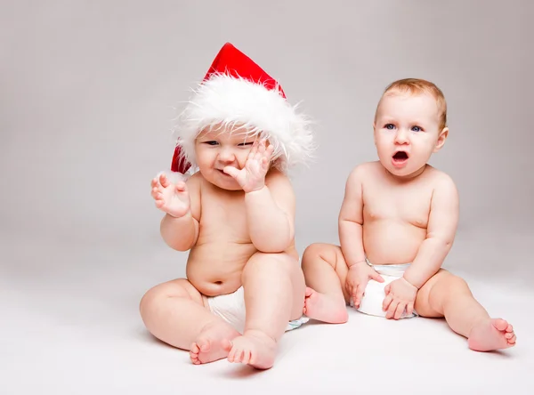 Christmas baby's over grijs — Stockfoto