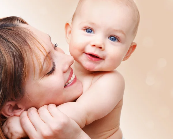 Bebé y su madre Fotos de stock