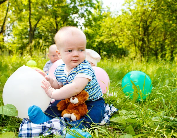 Babies with balloons — Stock Photo, Image