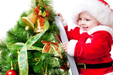 Baby decorating Christmas tree clipart