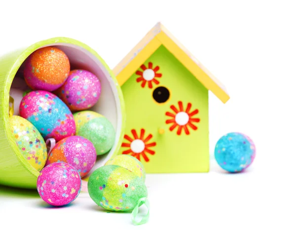 Easter eggs and birdhouse — Stock Photo, Image