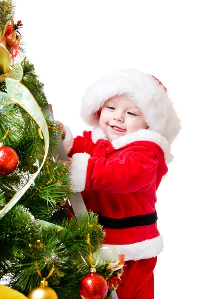 Baby decorating Christmas tree — Stock Photo, Image