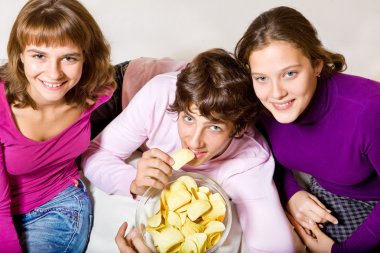 Teens eating crisps clipart